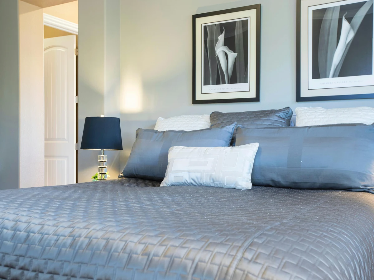 bedroom painting soft blue grey walls navy lamp grey satin bedding preston rose decor