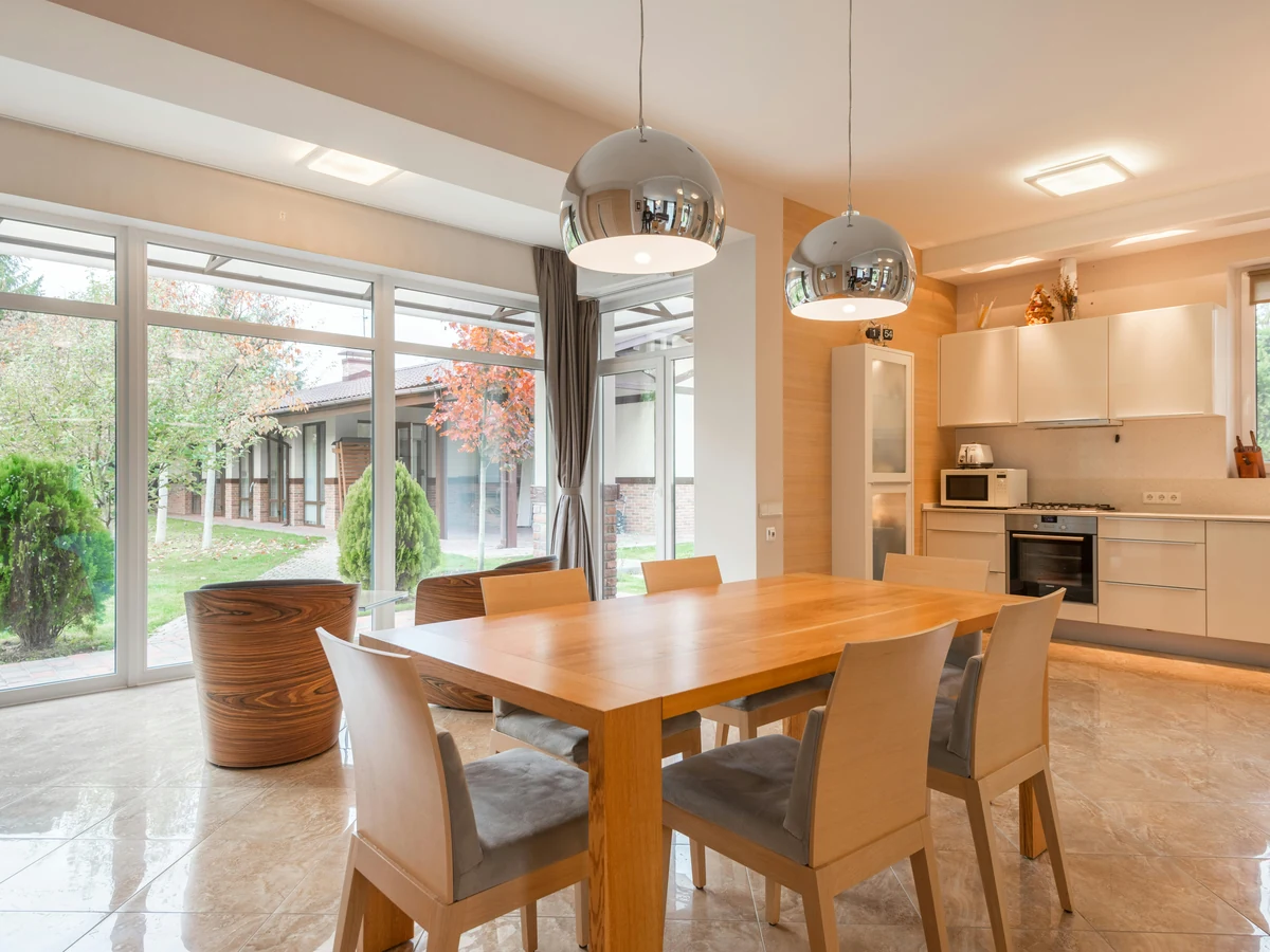 dining room painting warm beige open plan floor to ceiling windows preston rose decor