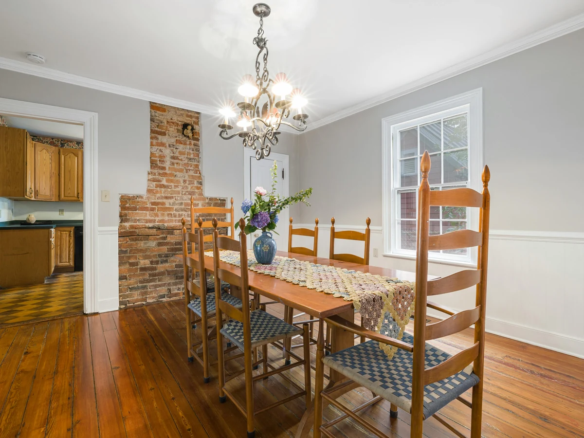 dining room painting warm light grey walls exposed brick chimney preston rose decor