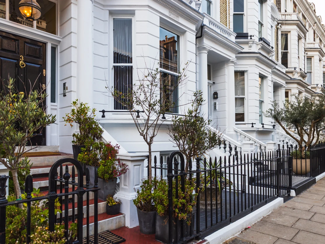 exterior-painting-grand-victorian-townhouse-white-stucco-ornate-columns-preston-rose-decor exterior painting grand victorian townhouse white stucco ornate columns preston rose decor