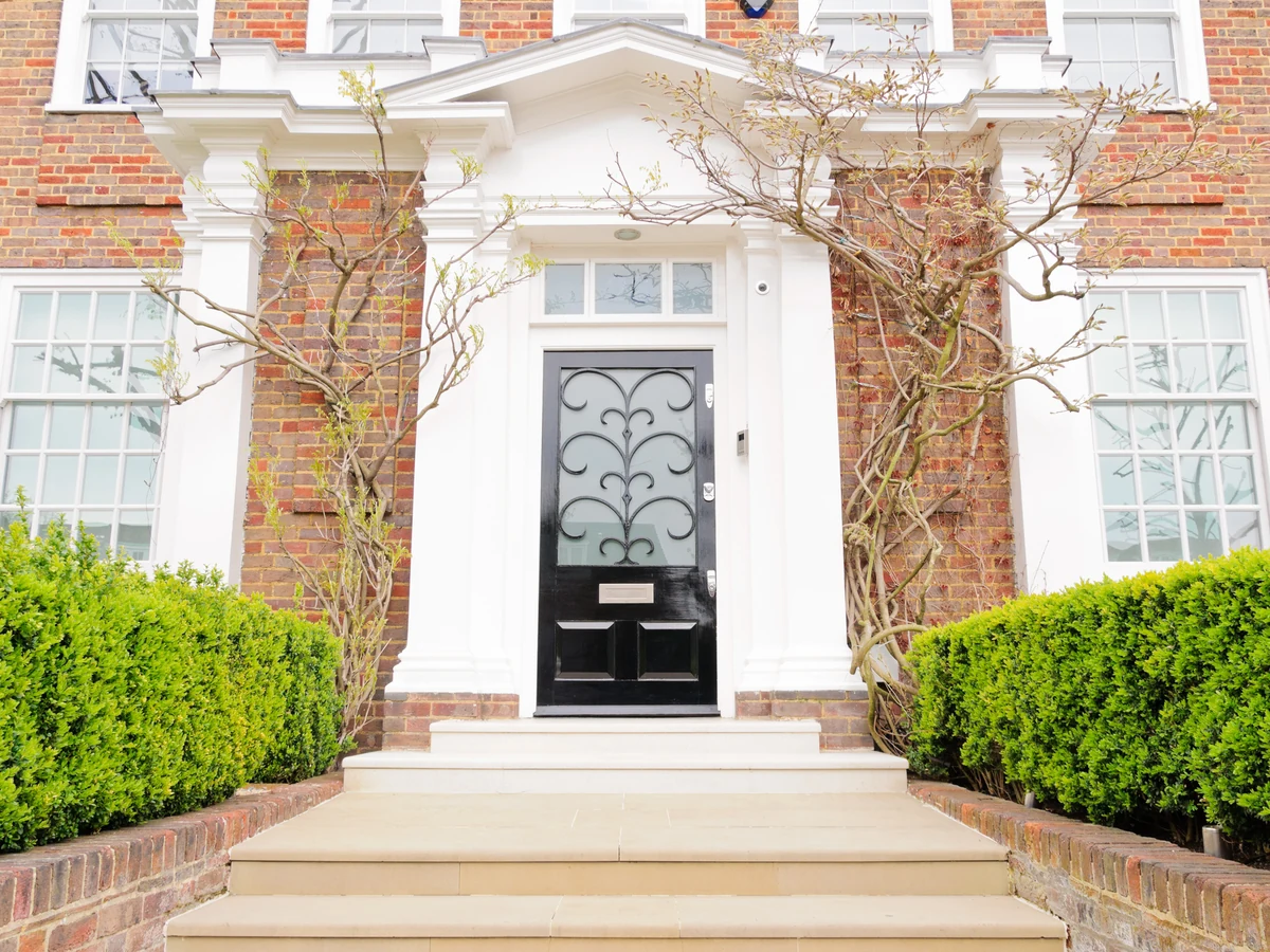 exterior painting large detached red brick white painted stone dressings grand door preston rose decor