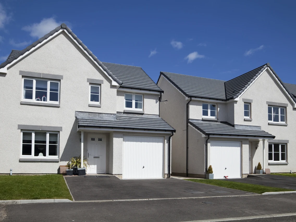 exterior-painting-new-build-detached-grey-roughcast-render-double-garage-modern-estate-preston-rose-decor exterior painting new build detached grey roughcast render double garage modern estate preston rose decor