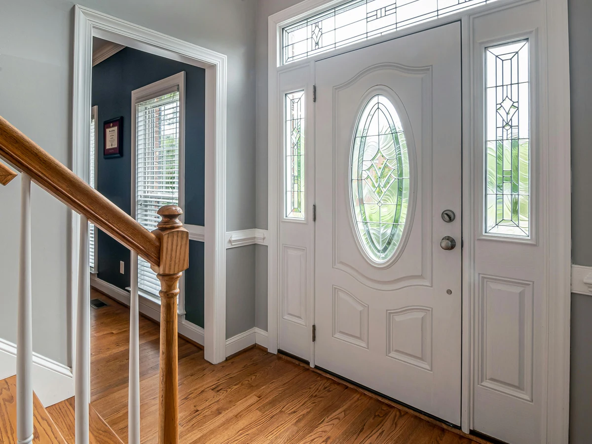 hallway-painting-blue-grey-walls-white-trim-white-front-door-oval-glass-insert-preston-rose-decor hallway painting blue grey walls white trim white front door oval glass insert preston rose decor