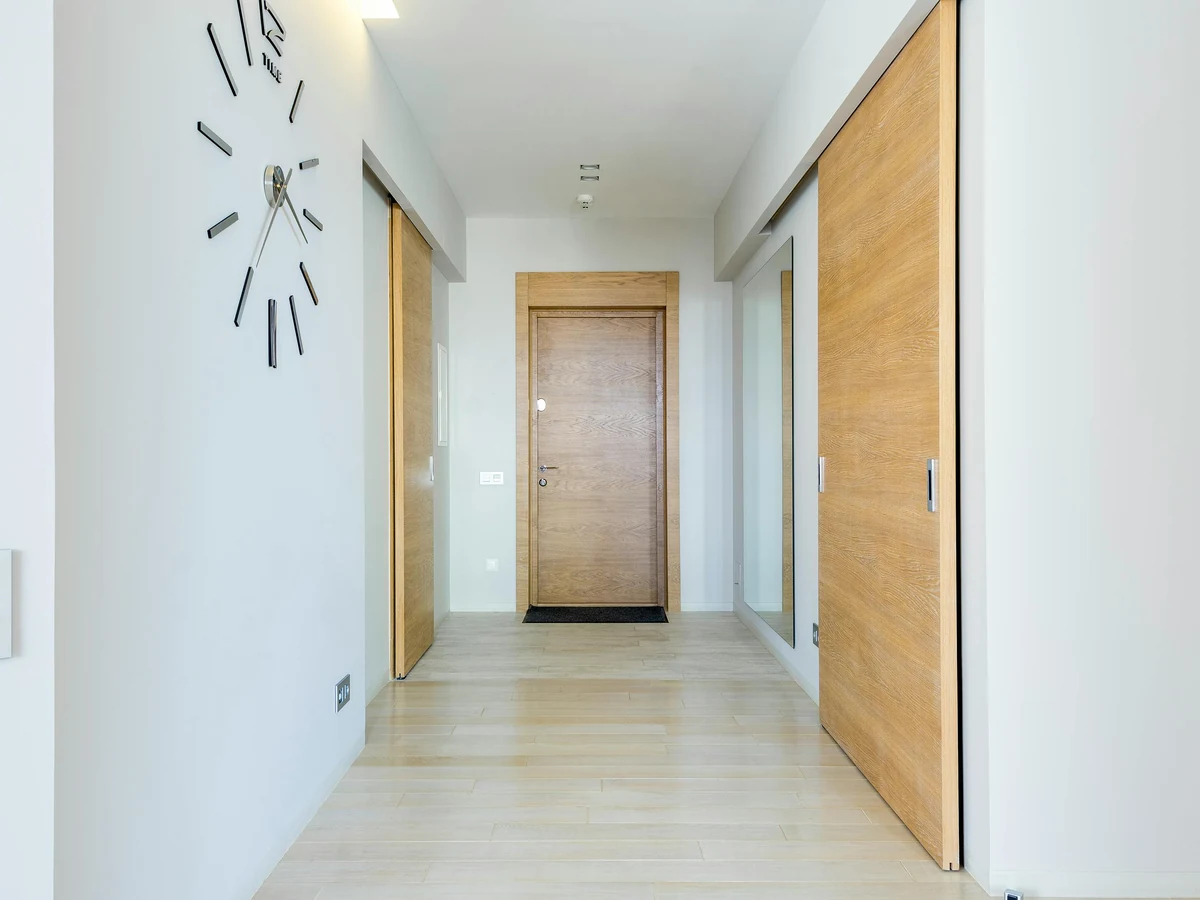 hallway-painting-bright-white-oak-sliding-wardrobes-clock-wall-preston-rose-decor hallway painting bright white oak sliding wardrobes clock wall preston rose decor