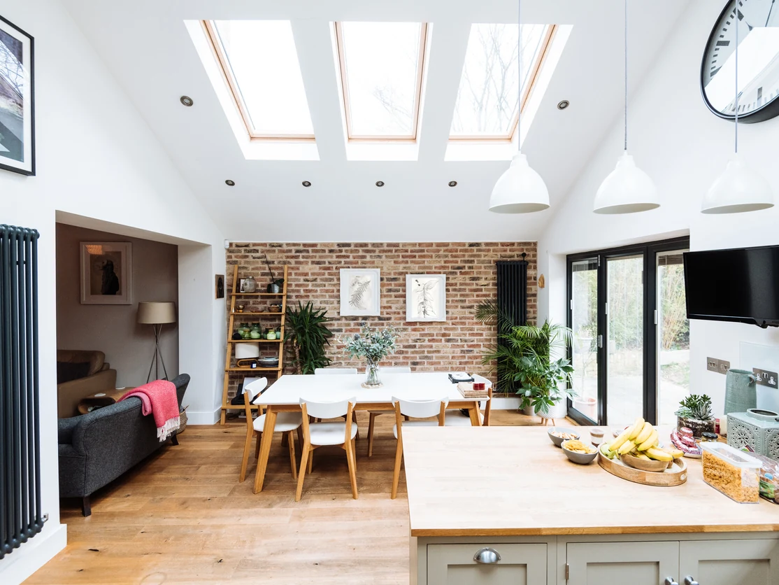 kitchen painting white ceiling exposed brick feature wall skylights preston rose decor